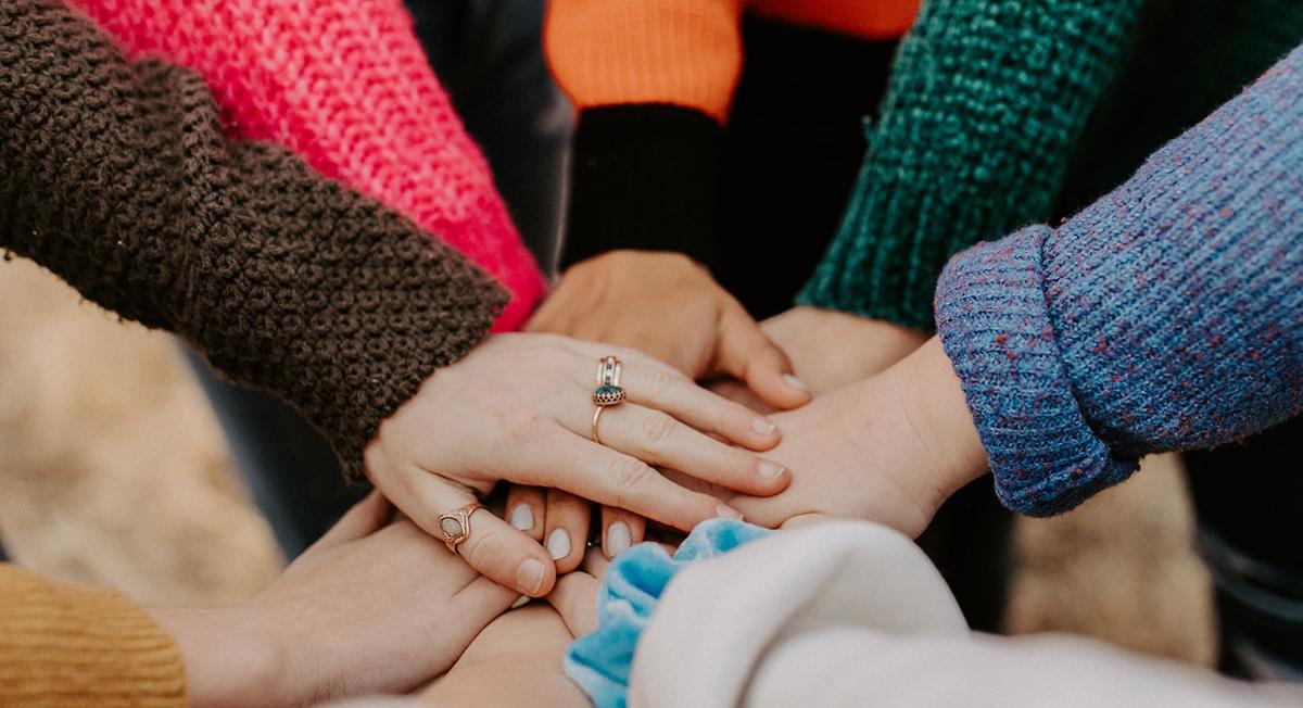 all hands supporting each other