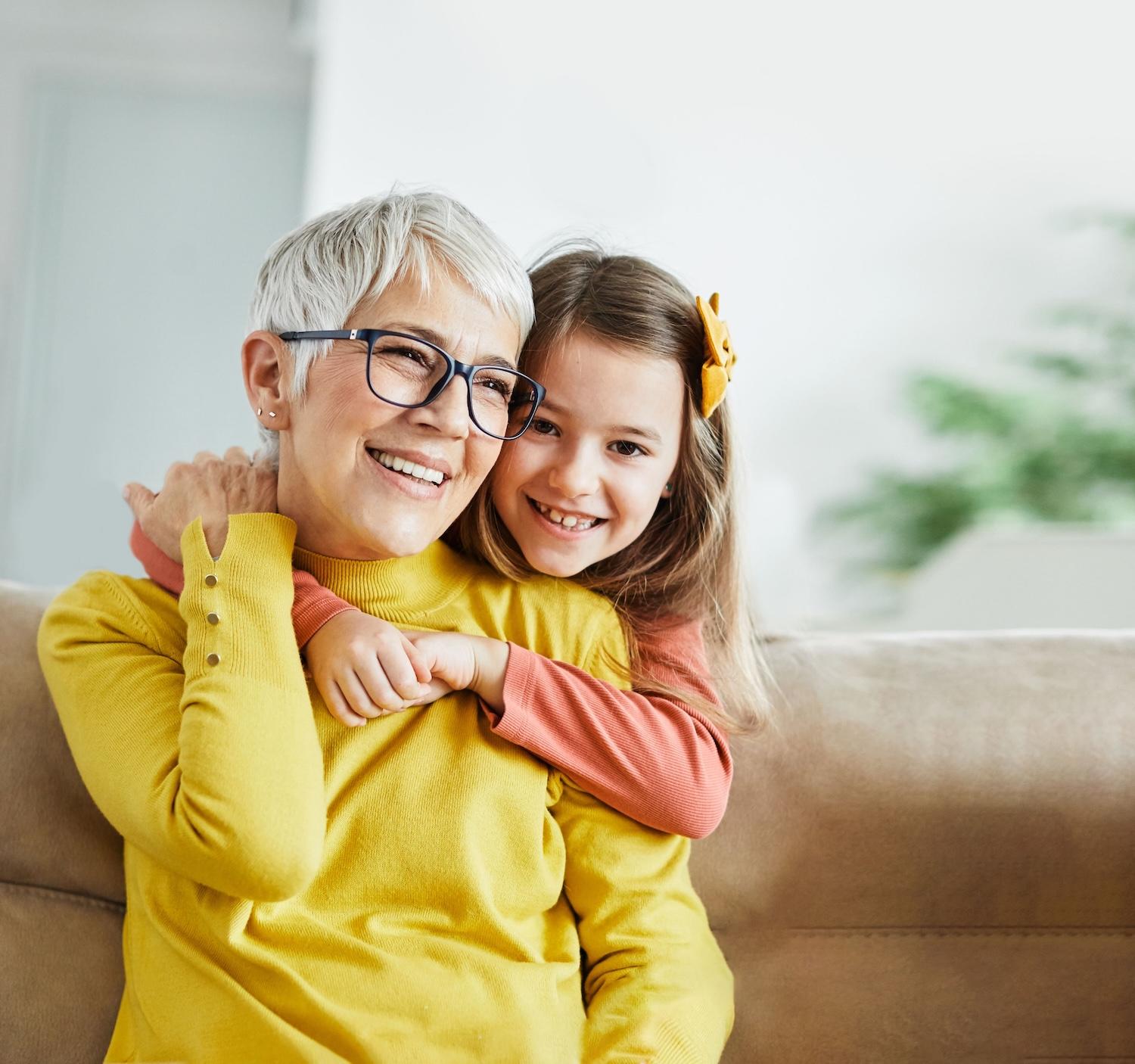 Woman with granddaughter after help from The Information Center