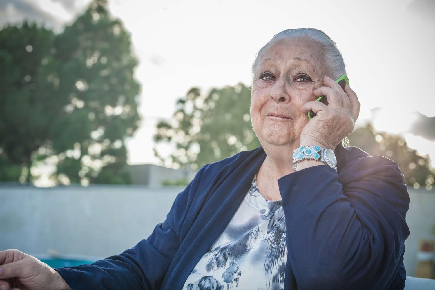 Senior woman calling The Information Center for Help
